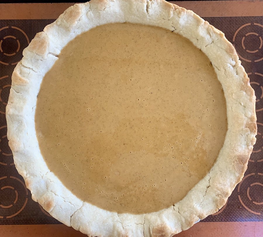 bird's eye view: slightly baked crust filled with unbaked pumpkin pie filling