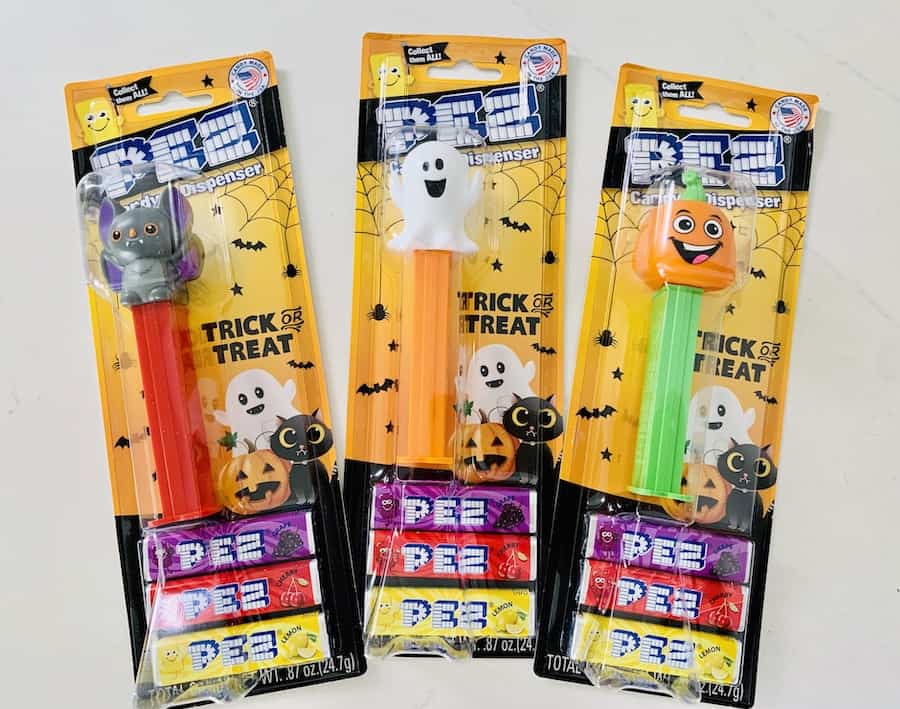 3 packages of PEZ candy and Halloween-themed dispensers: bat, ghost, and pumpkin