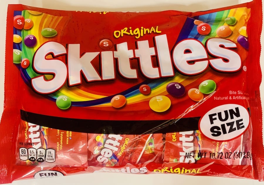 Red bag of Skittles candies.