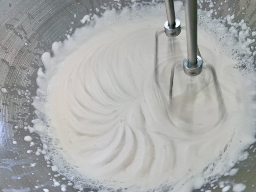 two beaters spinning and mixing whipped cream