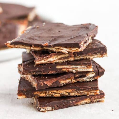 Stack of squares of layered chocolate crackers.
