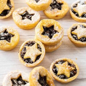 Mince pies with star shaped cut outs.