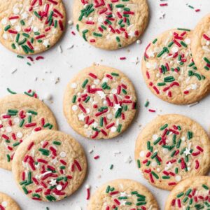 Bird's eye view: round sugar cookies with red, white and green sprinkles.