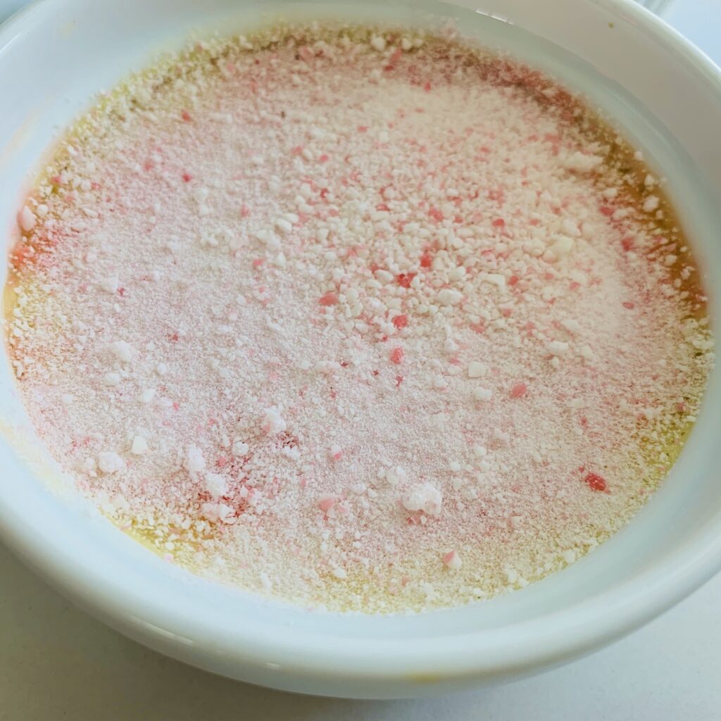 Creme brûlée covered with crushed candy canes, un-cooked.