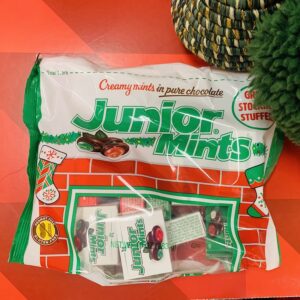 Bag of Junior Mints with red and green filling.
