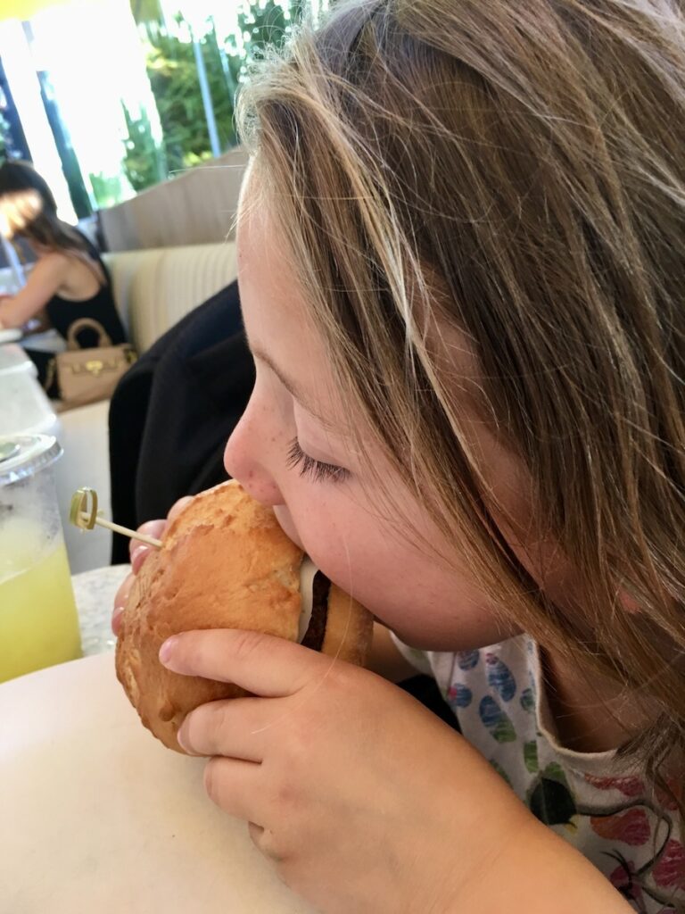 Miss E taking a bit of a gluten-free burger.