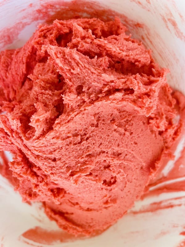 Pinkish-red colored dough.