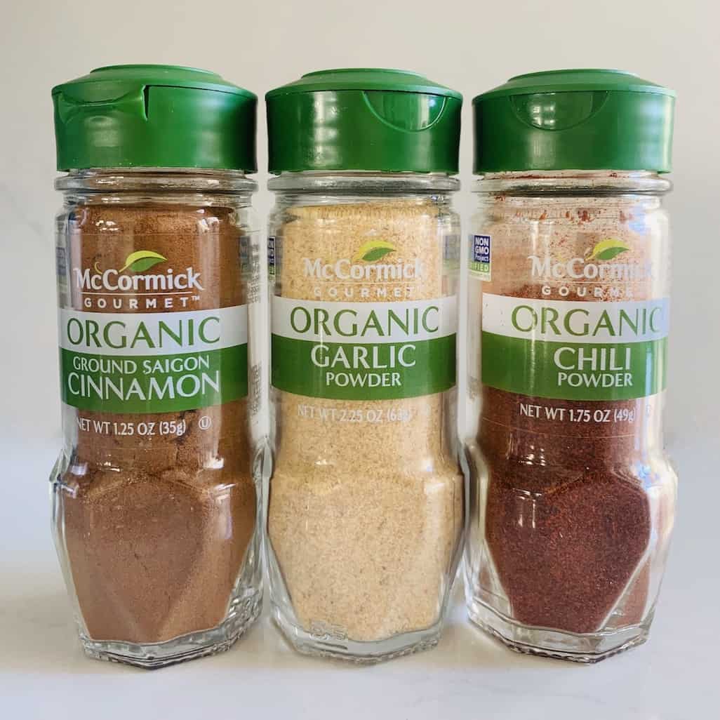 McCormick spice jars: cinnamon, garlic, and chili.