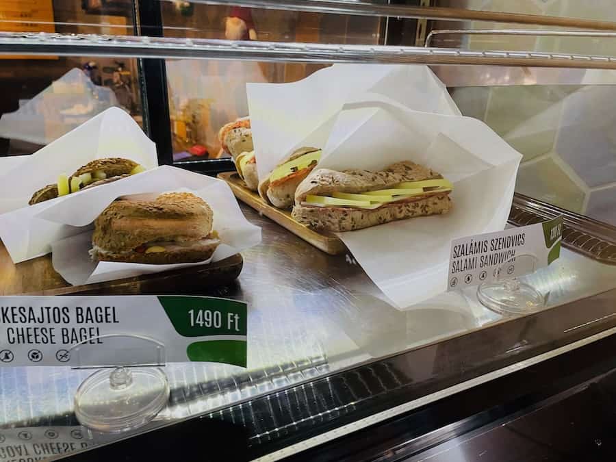 Gluten-free sandwiches in a bakery display case.