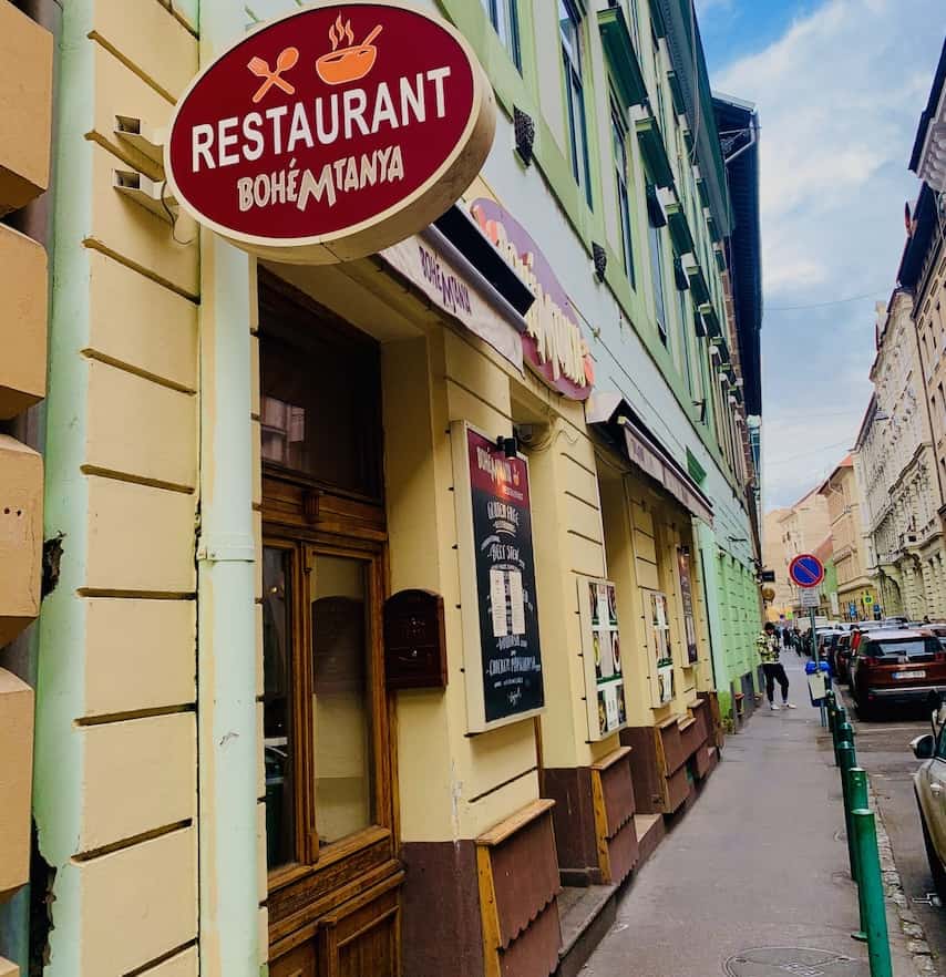 Outside restaurant with sign over the door, which reads "Restaurant Bohemtanya".