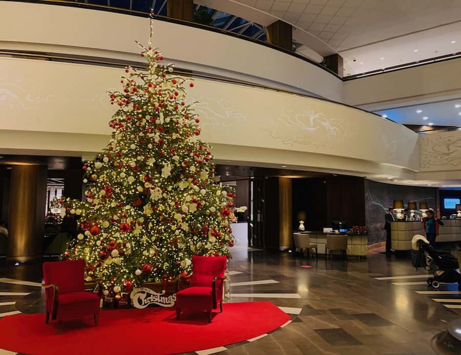 Hotel lobby with giant Christmas tree.