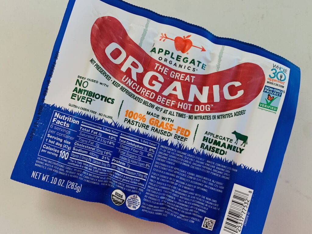Blue and white package of Applegate Organic Beef Hot Dogs.