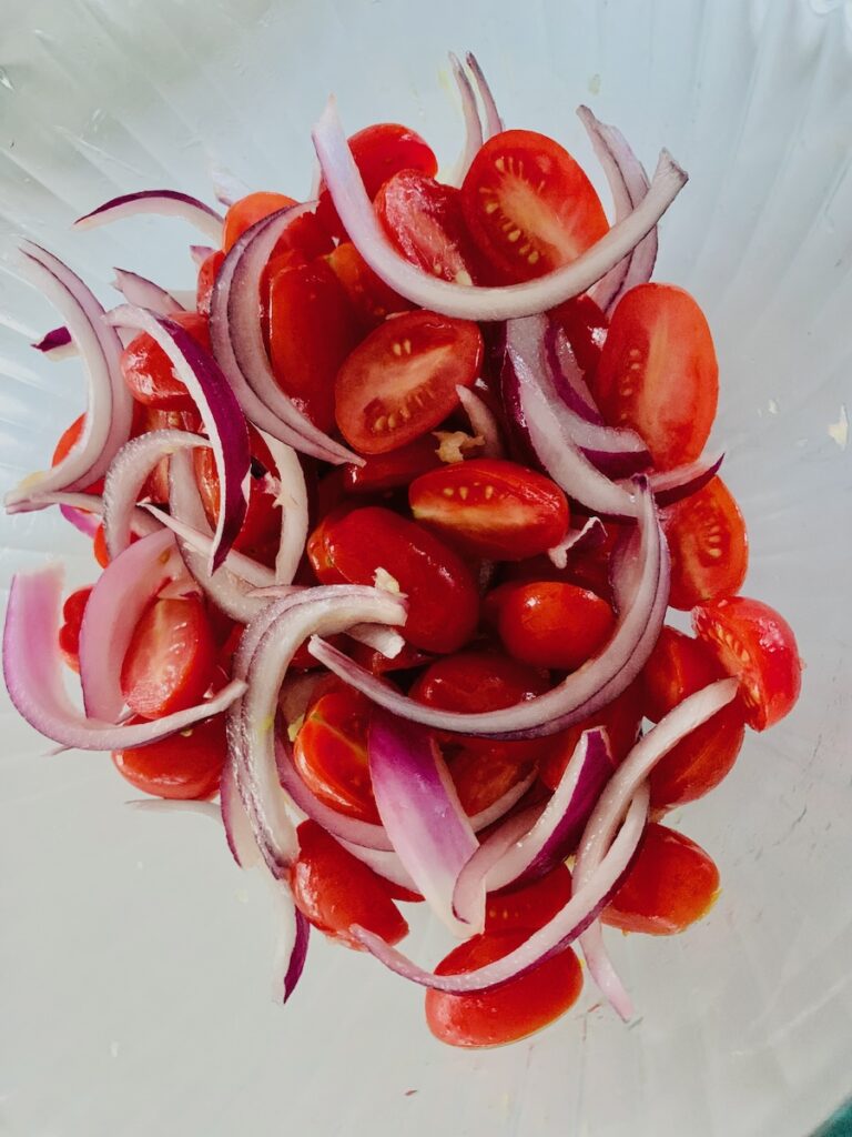 Birds Eye view: a mixture of tomatoes and red onions.
