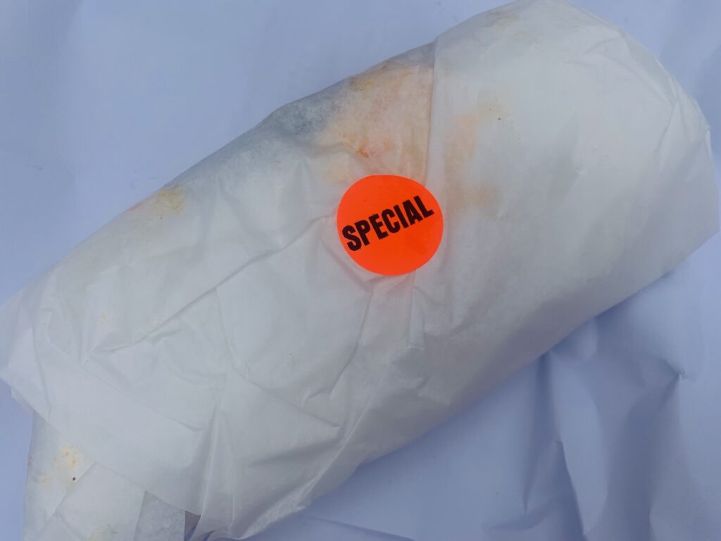 Wrapped food with a bright orange "special" sticker.